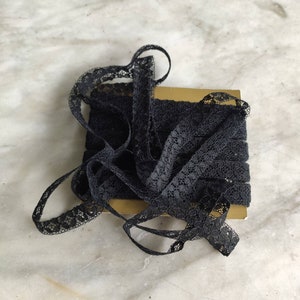 Antique black cotton lace inset trim.