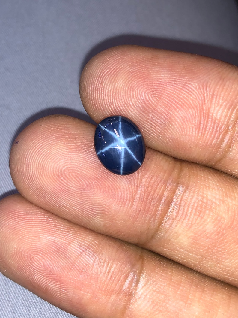 Natural Blue star sapphire 3.94crt oval cabochon top AAA quality.
