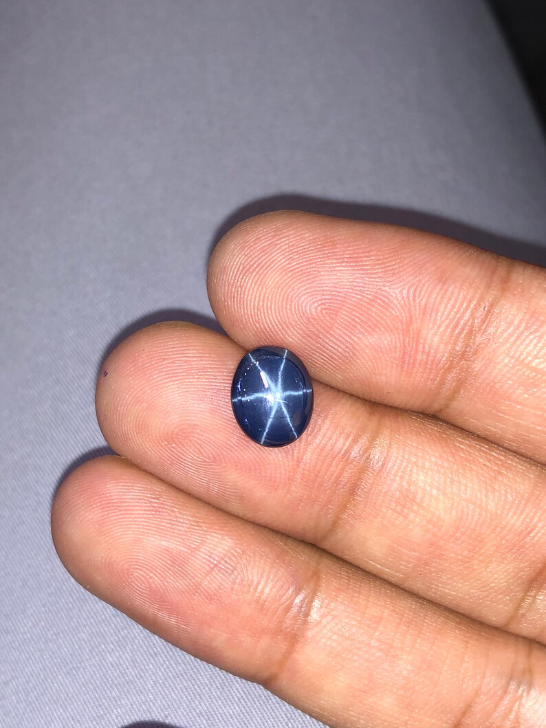 Natural Blue star sapphire 3.94crt oval cabochon top AAA quality.