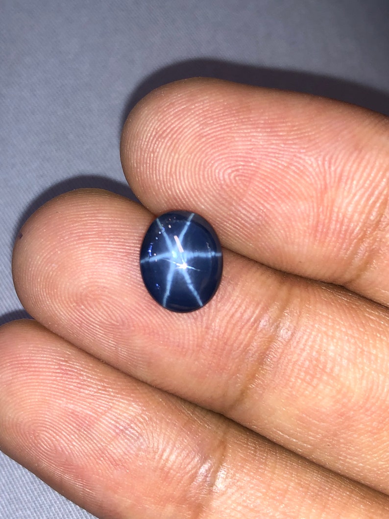 Natural Blue star sapphire 3.94crt oval cabochon top AAA quality.