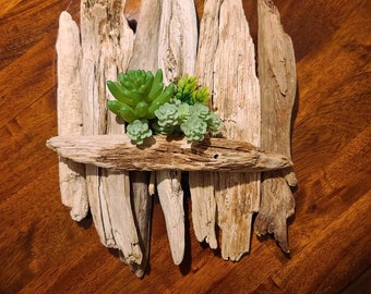 Maine driftwood sculpted by the waters in the beautiful Maine lakes. 111