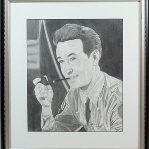 May include: A black and white pencil drawing of a man in a military uniform holding a pipe. He is looking to the right and smiling. The drawing is framed in a black and silver frame.