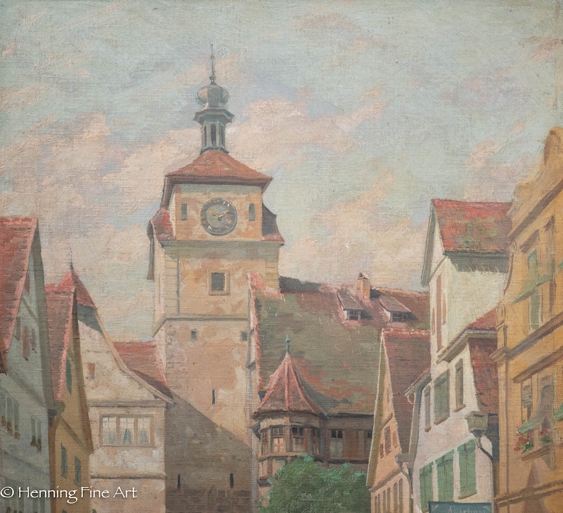 May include: A painting depicting a European town square with a tall clock tower in the center. The tower is a light brown color with a dark brown roof and a clock face on the front. The buildings surrounding the tower are also light brown with red tile roofs. The sky is a light blue with white clouds.