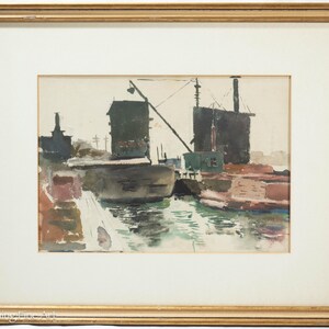 May include: Watercolor painting of a harbor scene with industrial buildings, a crane, and boats. The artwork features muted tones of gray, brown, green, and blue, framed in a gold-colored wooden frame. The painting has a vintage aesthetic.