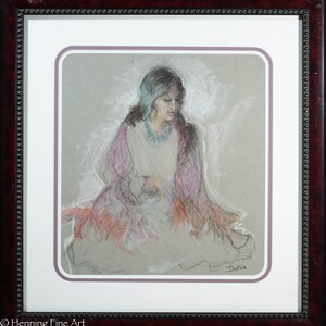 May include: A pastel drawing of a woman wearing a purple shawl with a turquoise necklace. The woman is sitting with her head down and her hands in her lap. The drawing is framed in a dark wood frame with a white mat.
