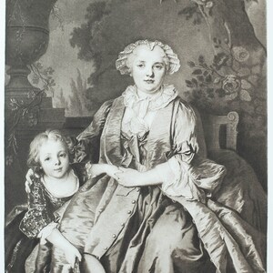 May include: A black and white portrait of a woman and a child. The woman is wearing a white cap and a long dress. The child is wearing a dress with a lace collar. The woman is holding the child's hand. The background is a garden with trees and flowers.