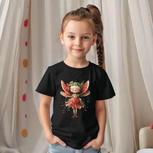 May include: A black t-shirt with a colorful illustration of a fairy made of watermelon and other fruits. The fairy has a red flower crown and a red dress.
