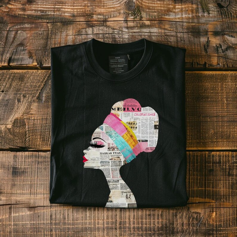 May include: Black t-shirt with a colorful graphic of a woman's face with a newspaper print head wrap. The graphic includes the text "MEILVG" and "CHLOROFORM INHALER".