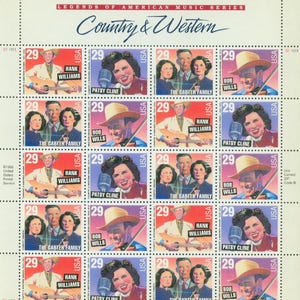 May include: A sheet of postage stamps from the "Legends of American Music Series" featuring country and western musicians. Each stamp has a 29-cent value and showcases Hank Williams, Patsy Cline, Bob Wills, and The Carter Family.