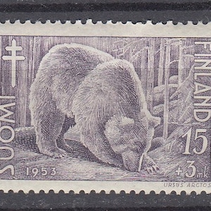 May include: Three 1953 Finland postage stamps featuring wildlife illustrations. The first is a red-brown stamp with a squirrel, the second is a purple stamp with a bear, and the third is a green stamp with a moose. Each stamp includes the text SUOMI FINLAND.