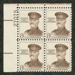 May include: A block of four vintage 8-cent U.S. postage stamps featuring a portrait of General John J. Pershing in military uniform. The stamps are sepia-toned, perforated, and include the plate number 27075 printed on the left margin selvage.