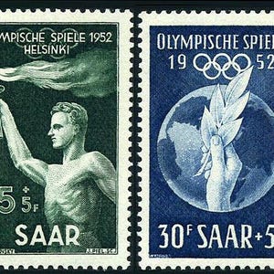 May include: Two vintage postage stamps. The left stamp is green and features a muscular man holding a torch, with text that reads "OLYMPISCHE SPIELE 1952 HELSINKI" and "SAAR". The right stamp is blue and shows a hand holding leaves, with text that reads "OLYMPISCHE SPIELE 1952" and "SAAR".