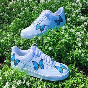 white nike butterfly shoes