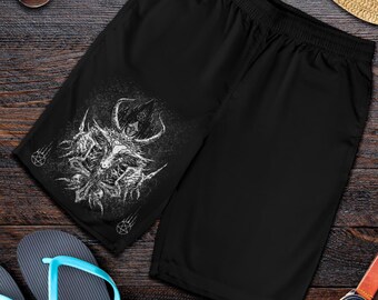 Puede incluir: Bañador negro con estampado gráfico blanco de un demonio cornudo con un pentagrama.