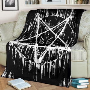 May include: Black and white throw blanket with a pentagram design. The pentagram is outlined in white and has a demonic face in the center.