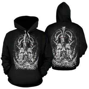 May include: Black hooded sweatshirt with a white graphic print of a three-headed goat with red eyes. The goat is surrounded by a circle of smaller goats and is wearing a robe.