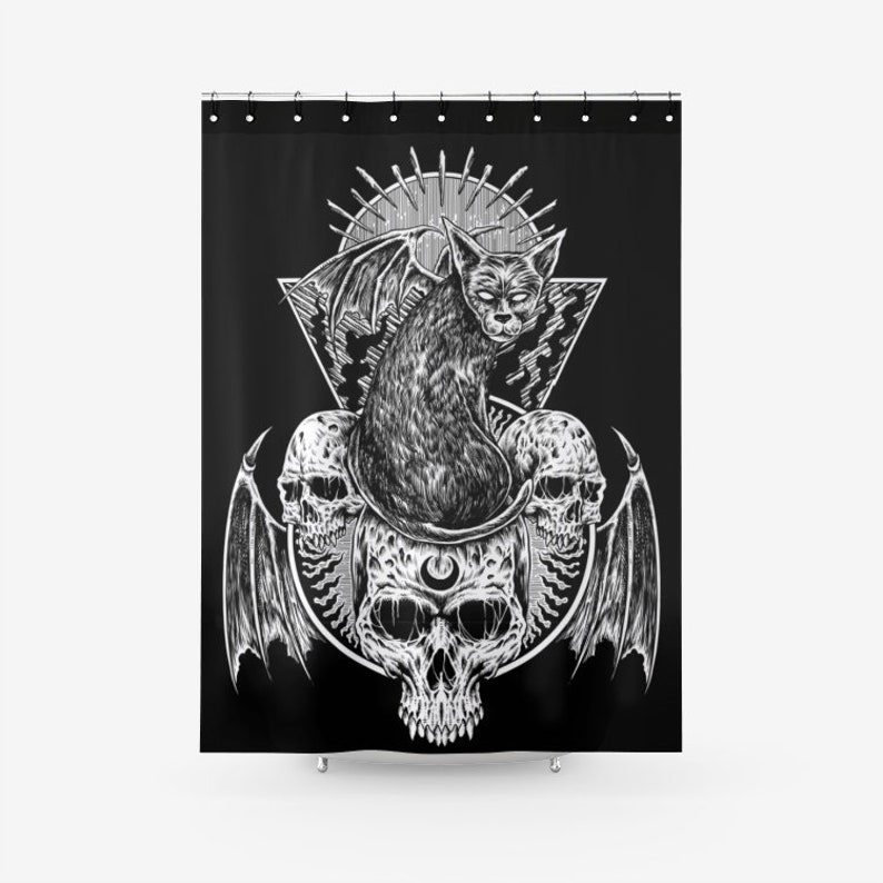 May include: Black and white illustration of a cat with wings sitting on top of three skulls. The cat is surrounded by a geometric design and a sunburst.