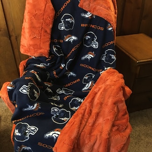Denver Broncos Soft Fleece Paired with Minky Luxe Hide Orange.  Two prints available