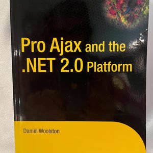 May include: A black book with a yellow bottom cover. The title is "Pro Ajax and the .NET 2.0 Platform" by Daniel Woolston. The book is published by Apress.