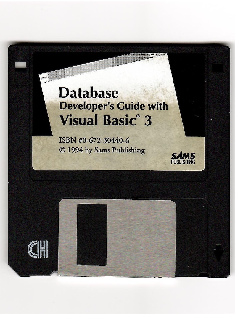 Op de afbeelding: Een zwarte 3,5-inch floppy disk met het label "Database Developer's Guide with Visual Basic&reg; 3", ISBN #0-672-30440-6 en copyright 1994 by Sams Publishing.
