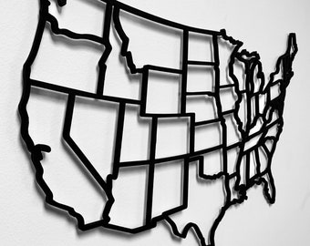 May include: A black metal outline of the United States of America, divided into individual states.