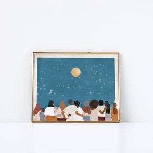 May include: A digital illustration of a group of people of different skin tones standing together, looking up at a full moon in a starry night sky. The people are all wearing casual clothing and have their arms around each other. The illustration is framed in a gold frame.