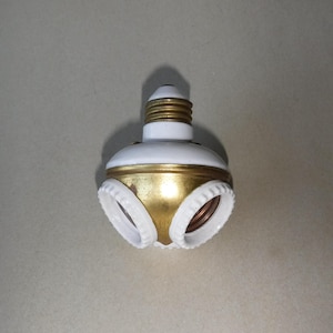 May include: A set of three ceramic vases in varying heights and shapes. The vases feature a matte white finish and a minimalist design, suitable for displaying flowers or as decorative objects. The tallest vase is approximately 10 inches tall.