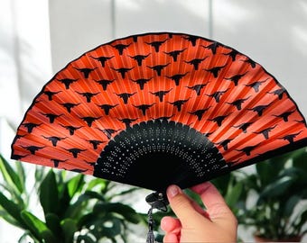 Ventilador de mano Texas Longhorn color naranja quemado, perfecto para climas cálidos #Hookem