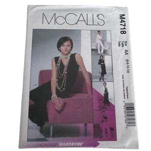 May include: A McCall's M4718 sewing pattern envelope for a non-stop wardrobe. The front features a black sleeveless dress, a white blazer, and matching trousers. The text includes the pattern number M4718, size AA (6-8-10-12), and the title Non-Stop Wardrobe.