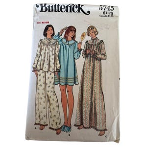 May include: Butterick sewing pattern 5745, size medium, featuring illustrations of three sleepwear styles: a floral pajama set, a solid light blue nightgown with ruffled trim, and a long floral nightgown with vertical stripes and a high neckline.