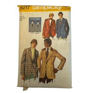 May include: A Simplicity sewing pattern envelope 5217 for a jacket in size 18 with a 48-inch chest. The front features illustrations of four jackets in various colors and patterns, including a red blazer, a blue blazer, a plaid jacket, and a tan jacket.