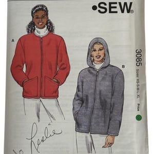 May include: A set of three ceramic mugs with a speckled, matte finish. The mugs are in shades of cream, light gray, and dark gray. Each mug has a simple, minimalist design and a rounded handle.