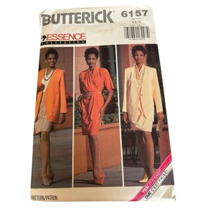 May include: Butterick Essence Collection sewing pattern 6157. The pattern features three women's fashion designs: a blazer and skirt, a wrap dress, and a suit. The pattern size is 6-8-10. The text "YES! IT'S EASY! OUI! C'EST FACILE!" is visible.