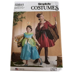 May include: Simplicity Costumes pattern S9841 featuring two children's costumes. One is a fairy with a blue dress and butterfly wings, the other is a devil in a red dress with a pitchfork. The pattern is designed and printed in the USA.