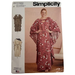 May include: A Simplicity sewing pattern envelope R11103 for a floor-length kaftan dress. The front shows a model wearing a dusty rose dress with a white and black floral print, featuring wide sleeves and a cutout neckline detail.