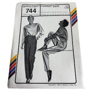 May include: A vintage sewing pattern titled "Stretch & Sew comfort pant 744." The cover features illustrations of two people wearing the pants. The pattern includes hip sizes from 32 to 48 inches. Copyright 1989 by Stretch & Sew, Inc.