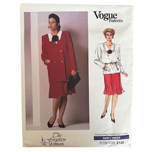 May include: A Vogue Patterns sewing pattern envelope, number 2126, featuring a red double-breasted jacket with a white collar and a matching red skirt. The cover displays a photograph of the outfit and a fashion illustration, with the text The Forgotten Woman.