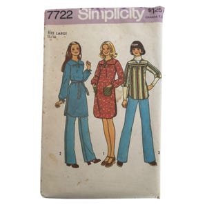 May include: Vintage Simplicity sewing pattern, size large, featuring three women's fashion designs. The designs include a blue tunic and pants, a red floral dress, and a striped shirt with blue pants. The pattern is labeled "7722 Simplicity".