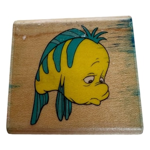 Estampillas de goma de Disney con forma de pez platija triste y personaje de La Sirenita