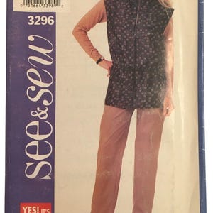 May include: A vintage sewing pattern with the text "see & sew" and "YES! IT'S easy". The pattern features a woman wearing a vest with a square pattern, a long-sleeved top, and pants. The pattern size is A/6-8-10.