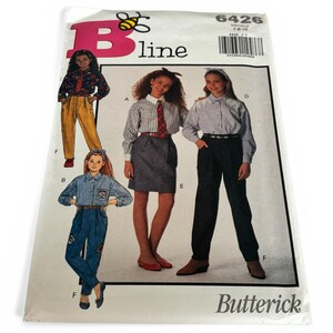 May include: A Butterick sewing pattern envelope, number 6426, for sizes 7-10. The front features illustrations of four outfits including a floral shirt with yellow trousers, a striped shirt with a skirt, and two denim-style shirt and pant sets.