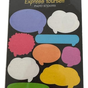 May include: A package of SandyLion sticker designs featuring colorful speech bubbles and labels. The package includes the text "Express Yourself" and "Acid Free". The stickers come in various shapes and colors, including blue, pink, orange, and yellow.