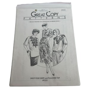 May include: A vintage sewing pattern titled "Great Copy Patterns" for a drop yoke skirt and pullover top. The pattern features illustrations of three women wearing the designed garments. The pattern is sealed in a clear plastic bag.