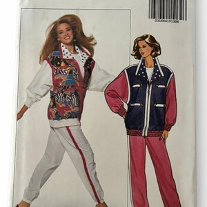 May include: Butterick pattern 6540 featuring two women's athletic outfits. One outfit is a white track suit with red accents and a patterned vest. The other is a pink and navy blue track suit. The pattern size is XS-S-M.