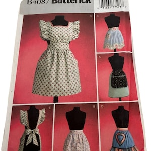 May include: A Butterick sewing pattern, B4087, showcasing different apron designs. The aprons are displayed on black mannequins against a red background. The aprons feature various styles, including floral prints, ruffles, and decorative elements.