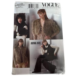 May include: Vogue Accessories V639 sewing pattern envelope featuring Anna Sui designs. The front displays five variations of faux fur accessories including a cropped shrug, a sleeveless vest, a hood, and leg warmers in shades of brown and black.