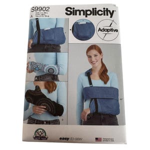 May include: Simplicity sewing pattern S9902 for an adaptive arm sling. The pattern includes instructions for an arm sling and wrist support. The package features images of the finished products and the text "easy-to-sew".
