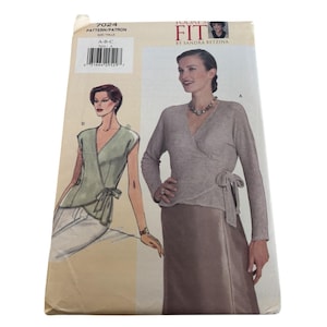 May include: A sewing pattern titled "Today's Fit" by Sandra Betzina. The pattern features illustrations of wrap tops and includes sizes A, B, and C. The cover is a light beige color.