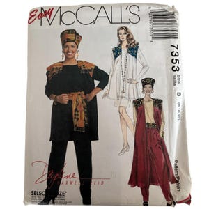 May include: Easy McCall's 7353 sewing pattern envelope featuring illustrations of three outfits including a black tunic and pants set, a white dress with a patterned vest, and a maroon skirt set with a matching vest, all with headwear accessories.