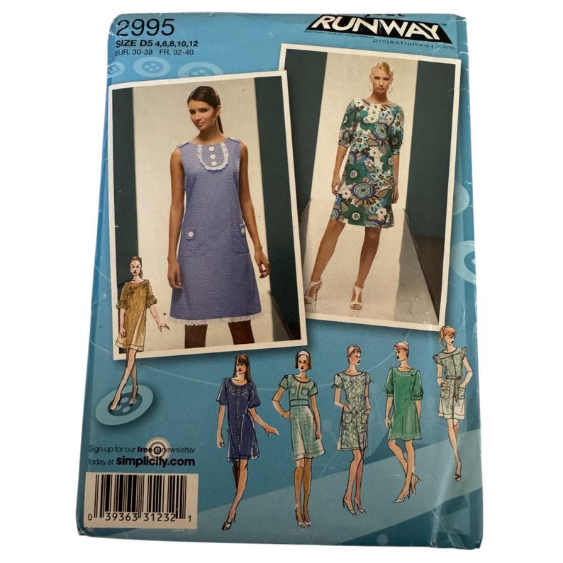 May include: A Simplicity sewing pattern envelope, number 2995, featuring Project Runway branding. The blue package displays illustrations and photographs of various dress designs, including a sleeveless blue dress with white trim and a floral print dress.